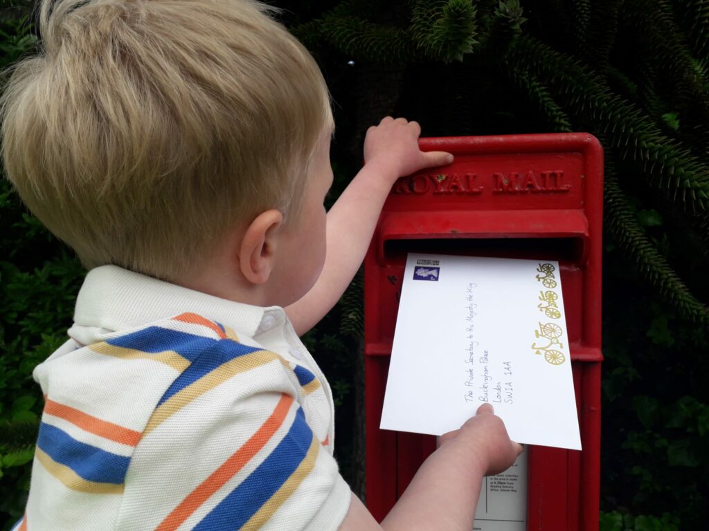 3 year old posting the letter 